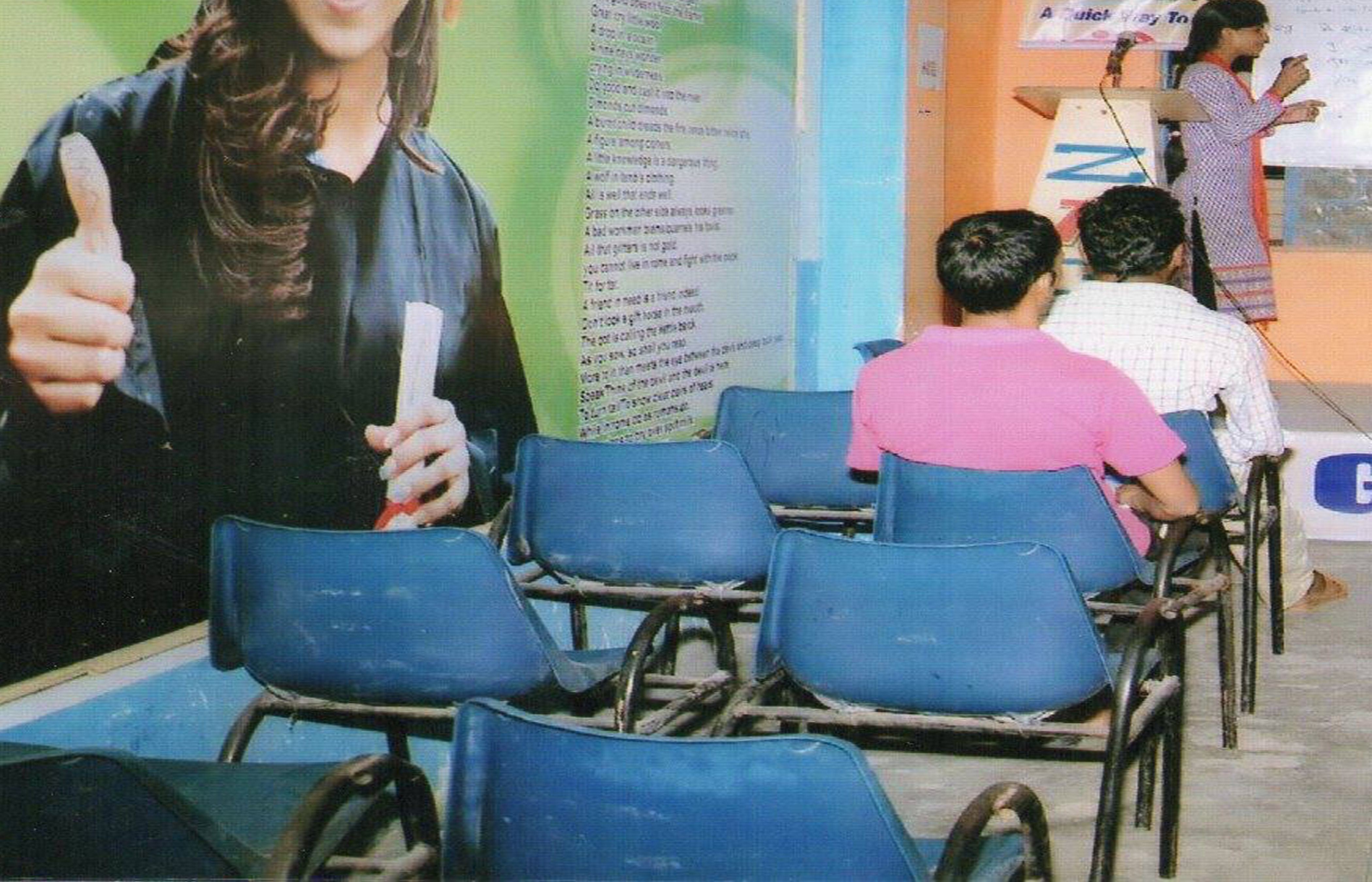 Man with a beard smiling confidently against a plain background